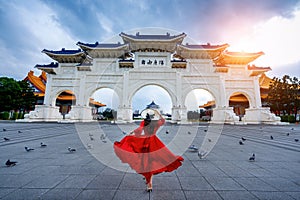 Woman walking at Archway of Chiang Kai Shek Memorial Hall in Taipei, Taiwan.