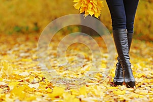 Woman walking in autumn park