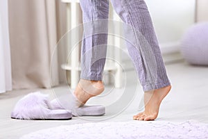 Woman walking barefoot at home