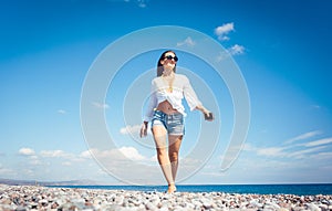 Woman walking on the beach