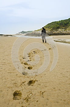 Woman walking on beach