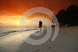 Woman walking on beach