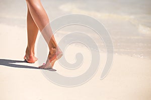 Woman walking on the beach