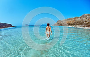 Woman walking on the beach