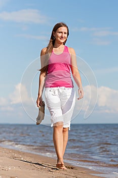 Woman walking on beach