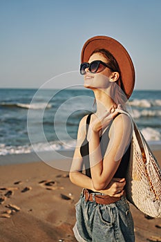 woman walking on the beach landscape sun fun lifestyle