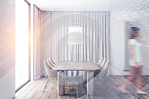 Woman walking in beige chairs dining room