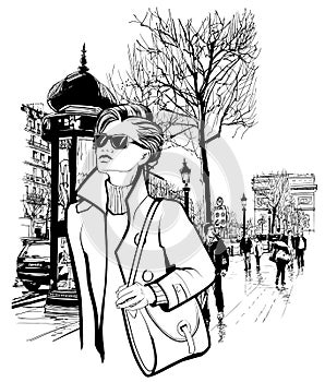 Woman walking in Champs-Elysees avenue in Paris photo