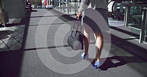 woman walking in the corridor at office 4k