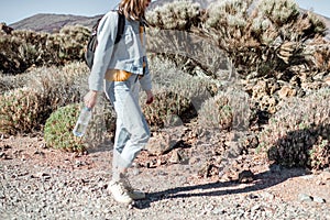 Woman walking desert road