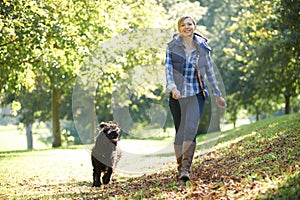 Woman walking dog