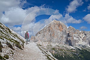 Woman walking in Dolomite mountains