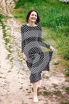 Woman walking down along the path