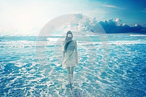 Woman walking on dreamy beach enjoying ocean view