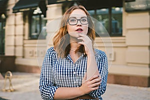 Woman walking in dress in old city. Fashion Style Photo Of A Young Girl. happy stylish woman at old european city street