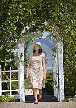 Woman Walking in Garden