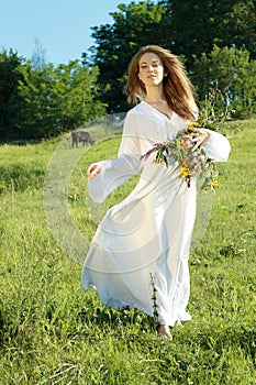 Woman walking on the grass outdoors