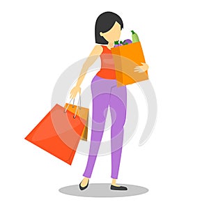 Woman walking from the grocery store with shopping bags