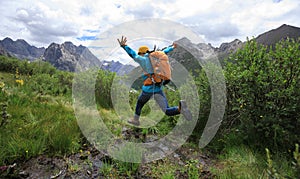 Woman walking in high altitude mountains