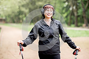 Woman walking with hiking sticks