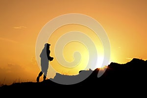 Woman walking on the hill