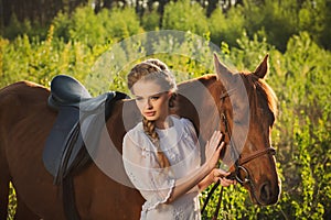 Woman walking with horse in the forest