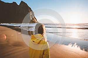 Woman walking on Kvalvika beach in Norway travel solo