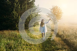 Woman walking in the morning and enjoy nature at sunrise