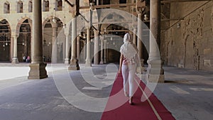 Woman is walking in the mosque of sultan Mohamed ibn Qalawun.