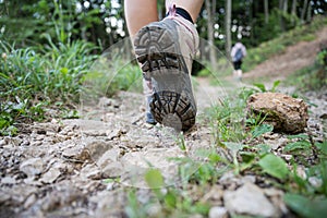 Woman walking on mountain trail