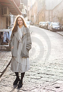 Woman walking in the old town.