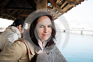 Woman walking on an old wooden bridge