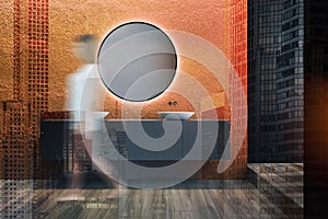 Woman walking in orange bathroom interior