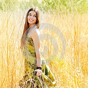 Woman walking outdoors in golden field