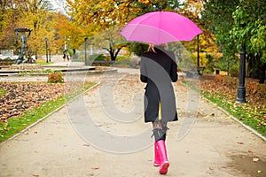 Woman walking in park in autumn