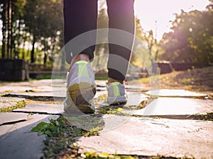 Woman walking Park outdoor Jogging Exercise morning sunlight