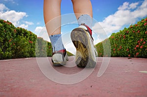 Woman walking in the park, sport shoe