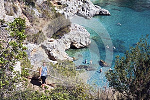 Woman walking the path to go to the beach.