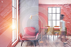 Woman walking in pink and gray dining room