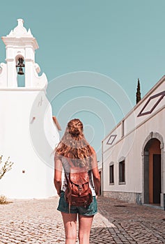 Woman walking in portuguese street- Tavira