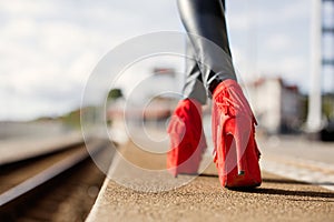 Woman walking in red high heels