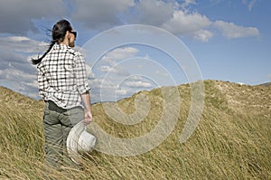 Woman walking in sand dunes