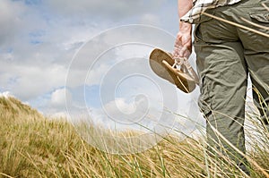 Woman walking in sand dunes