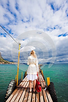 Woman walking on sea footbridge