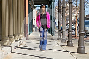 Woman Walking On Sidewalk