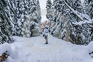 Woman walking through the snow
