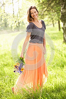 Woman Walking Through Summer Field