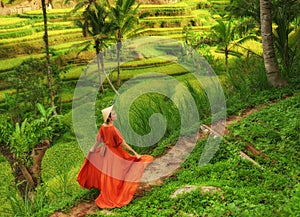 Woman walking on Tegalalang Rice Terrace, Bali photo