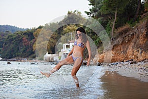 Woman walking at Thassos beach