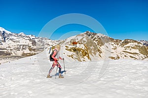 Woman walking with trekking poles